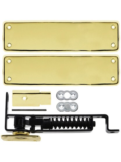Heavy Duty Swinging Door Floor Hinge With Solid Brass Cover Plates in Polished Brass.